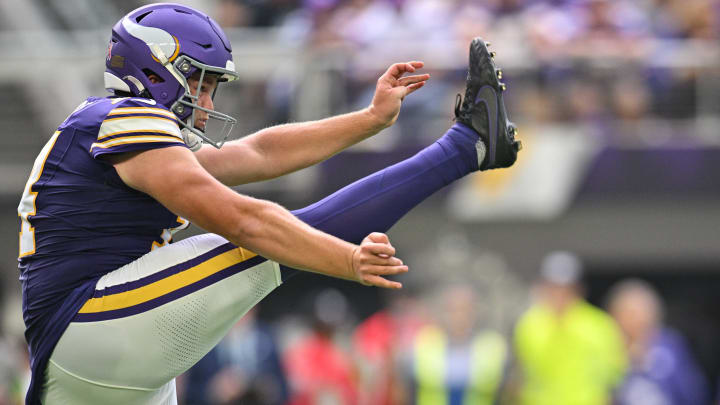 Sep 10, 2023; Minneapolis, Minnesota, USA; Minnesota Vikings punter Ryan Wright (14) punts the ball during the game against the Tampa Bay Buccaneers at U.S. Bank Stadium. Mandatory Credit: Jeffrey Becker-USA TODAY Sports