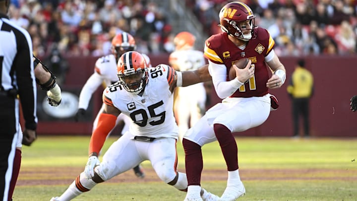 Cleveland Browns defensive end Myles Garrett sacks Washington Commanders quarterback Carson Wentz. Cleveland Browns defensive end Myles Garrett sacks Washington Commanders quarterback Carson Wentz.