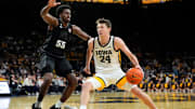 Iowa forward Pryce Sandfort (24) drives to the basket against Michigan State forward Coen Carr (55) during a Big Ten Conference game Thursday, March 6, 2025 at Carver-Hawkeye Arena in Iowa City.