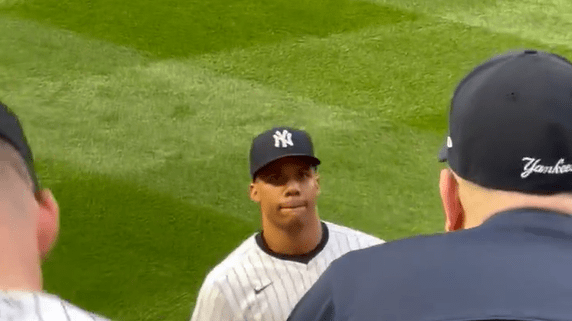 Juan Soto signed a baseball for a Yankees fan during the club's game vs. the Marlins at Yankee Stadium on Monday night. 