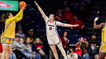 Mickayla Perdue attempting to block a shot against CSU Bakersfield.
