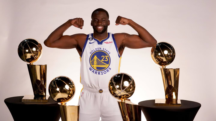 Sep 25, 2022; San Francisco, CA, USA; Golden State Warriors forward Draymond Green (23) poses with the Larry O'Brien Championship Trophies during Media Day at the Chase Center. Mandatory Credit: Cary Edmondson-USA TODAY Sports