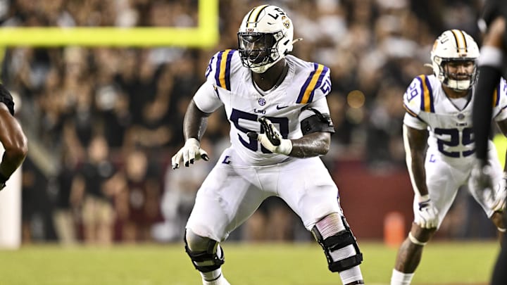 Oct 26, 2024; College Station, Texas, USA; LSU Tigers offensive lineman Emery Jones Jr. (50) lines up during the second quarter against the Texas A&M Aggies. The Aggies defeated the Tigers 38-23; at Kyle Field. Mandatory Credit: Maria Lysaker-Imagn Images.  
