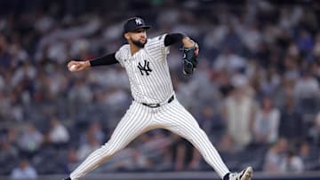 Jul 10, 2025; Bronx, New York, USA; New York Yankees relief pitcher Devin Williams (38) pitches against the Seattle Mariners during the tenth inning at Yankee Stadium. Mandatory Credit: Brad Penner-Imagn Images