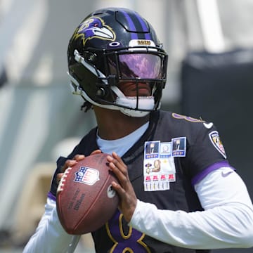 Jul 23, 2025; Owings Mills, MD, USA; Baltimore Ravens quarterback Lamar Jackson (8) warms up during training camp at Under Armour Performance Center. Mandatory Credit: Mitch Stringer-Imagn Images