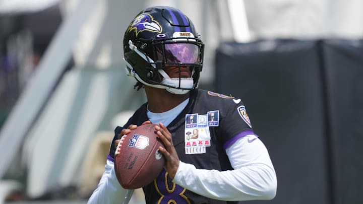 Jul 23, 2025; Owings Mills, MD, USA; Baltimore Ravens quarterback Lamar Jackson (8) warms up during training camp at Under Armour Performance Center. Mandatory Credit: Mitch Stringer-Imagn Images