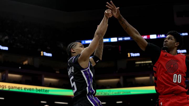 Oct 23, 2026; Sacramento, California, USA;  Sacramento Kings guard Darius Acuff Jr. (5) shoots over Portland Trail Blazers guard Scoot Henderson (00) during the fourth quarter at Golden 1 Center.  Mandatory Credit: Dennis Lee-Imagn Images