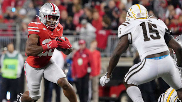 Sept. 7, 2024; Columbus, Ohio, USA;Ohio State Buckeyes running back James Peoples (20) is pursued by Western Michigan Bronco