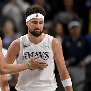 Mar 9, 2025; Dallas, Texas, USA; Dallas Mavericks guard Spencer Dinwiddie (26) and guard Klay Thompson (31) walk off the court after the loss to the Phoenix Suns at the American Airlines Center. Mandatory Credit: Jerome Miron-Imagn Images