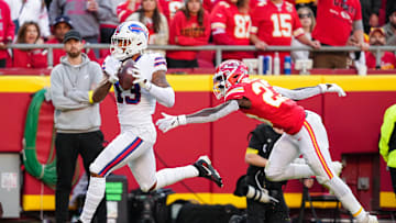 Oct 16, 2022; Kansas City, Missouri, USA; Buffalo Bills wide receiver Gabe Davis (13) scores a touchdown against Kansas City Chiefs cornerback Joshua Williams (23) during the first half at GEHA Field at Arrowhead Stadium. Mandatory Credit: Jay Biggerstaff-Imagn Images