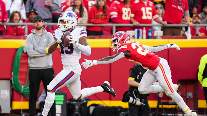Oct 16, 2022; Kansas City, Missouri, USA; Buffalo Bills wide receiver Gabe Davis (13) scores a touchdown against Kansas City Chiefs cornerback Joshua Williams (23) during the first half at GEHA Field at Arrowhead Stadium. Mandatory Credit: Jay Biggerstaff-Imagn Images