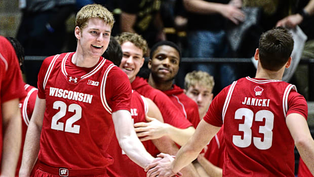 Feb 15, 2025; West Lafayette, Indiana, USA; Wisconsin Badgers forward Steven Crowl (22) shakes hands with guard Jack Janicki 
