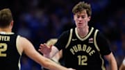 Purdue Boilermakers center Daniel Jacobsen (12) fives guard Fletcher Loyer (2)
