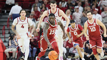 Jan 25, 2025; Fayetteville, Arkansas, USA; Oklahoma Sooners guard Duke Miles (15) controls the ball against Arkansas Razorbacks forward Zvonimir Ivisic (44) in the first half at Bud Walton Arena. Mandatory Credit: Nelson Chenault-Imagn Images