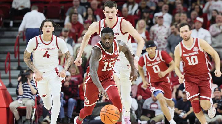Jan 25, 2025; Fayetteville, Arkansas, USA; Oklahoma Sooners guard Duke Miles (15) controls the ball against Arkansas Razorbacks forward Zvonimir Ivisic (44) in the first half at Bud Walton Arena. Mandatory Credit: Nelson Chenault-Imagn Images