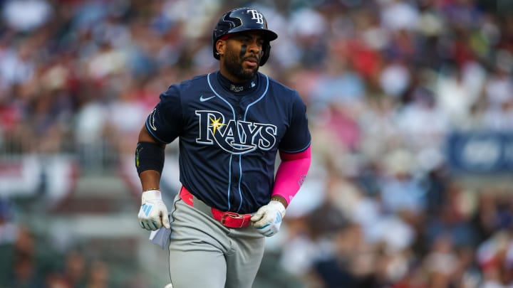 Jun 14, 2024; Atlanta, Georgia, USA; Tampa Bay Rays first baseman Yandy Diaz (2) hits a single against the Atlanta Braves in the first inning at Truist Park