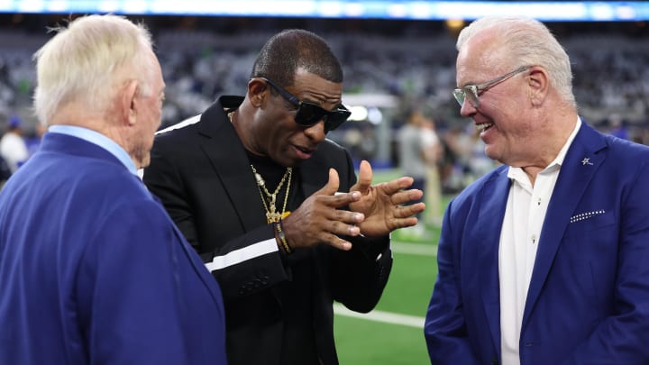  Colorado Buffaloes head coach Deion Sanders (center) talks with Dallas Cowboys owner Jerry Jones (left) and Cowboys CEO Stephen Jones