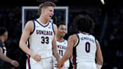 Mar 20, 2025; Wichita, KS, USA; Gonzaga Bulldogs forward Ben Gregg (33) celebrates with guard Ryan Nembhard (0) and guard Nolan Hickman (11) after a play in the first half of a first round men’s NCAA Tournament game against the Georgia Bulldogs at Intrust Bank Arena. 