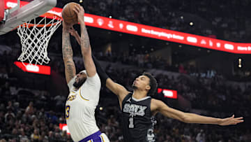Nov 15, 2024; San Antonio, Texas, USA; Los Angeles Lakers forward Anthony Davis (3) goes up to dunk past San Antonio Spurs center Victor Wembanyama (1) during the second half at Frost Bank Center. 