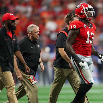 Aug 31, 2024; Atlanta, Georgia, USA; Georgia Bulldogs defensive lineman Mykel Williams (13) goes off the field with an injury against the Clemson Tigers in the third quarter at Mercedes-Benz Stadium. Mandatory Credit: Brett Davis-Imagn Images
