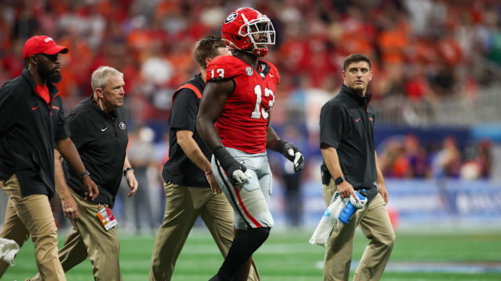 Aug 31, 2024; Atlanta, Georgia, USA; Georgia Bulldogs defensive lineman Mykel Williams (13) goes off the field with an injury against the Clemson Tigers in the third quarter at Mercedes-Benz Stadium. Mandatory Credit: Brett Davis-Imagn Images
