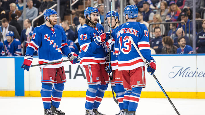 Apr 4, 2026; New York, New York, USA; New York Rangers center Mika Zibanejad (93) talks to left wing Alexis Lafreniere (13) and defenseman Vladislav Gavrikov (44) during the second period against the Detroit Red Wings at Madison Square Garden. 