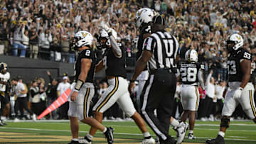 Oct 25, 2025; Nashville, Tennessee, USA; Vanderbilt Commodores quarterback Diego Pavia (2) celebrates his one-yard touchdown run against the Missouri Tigers during the fourth quarter at FirstBank Stadium. 