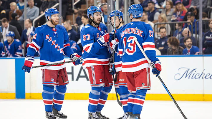 Apr 4, 2026; New York, New York, USA; New York Rangers center Mika Zibanejad (93) talks to left wing Alexis Lafreniere (13) and defenseman Vladislav Gavrikov (44) during the second period against the Detroit Red Wings at Madison Square Garden. 
