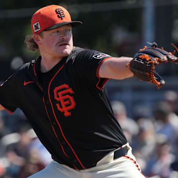 Mar 15, 2025; Scottsdale, Arizona, USA; San Francisco Giants pitcher Logan Webb (62) throws against the Seattle Mariners in the first inning at Scottsdale Stadium. 