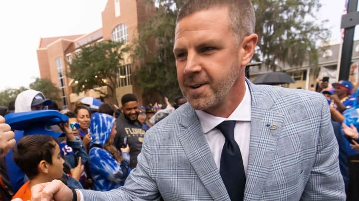 Florida Gators head coach Billy Napier gives fist bumps to fans during Gator Walk at Ben Hill Griffin Stadium in Gainesville, FL on Saturday, November 25, 2023 befoe the game against the Florida State Seminoles. [Doug Engle/Gainesville Sun]