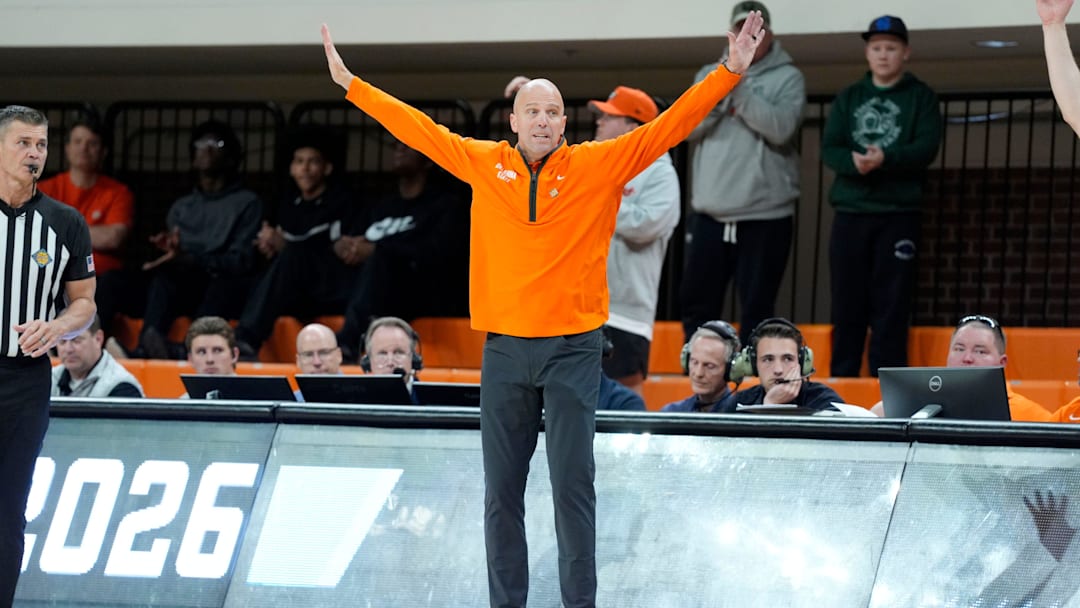 Oklahoma State coach Steve Lutz leaps during a first-round basketball game in the National Invitational between the Oklahoma State Cowboys and the Davidson Wildcats at Gallagher-Iba Arena in Stillwater, Okla., Tuesday, March 17, 2026. Oklahoma State won 84-80.