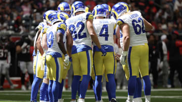 Aug 24, 2024; Houston, Texas, USA;  Los Angeles Rams quarterback Dresser Winn (4) calls a play in the huddle against the Houston Texans in the fourth quarter at NRG Stadium. Mandatory Credit: Thomas Shea-USA TODAY Sports