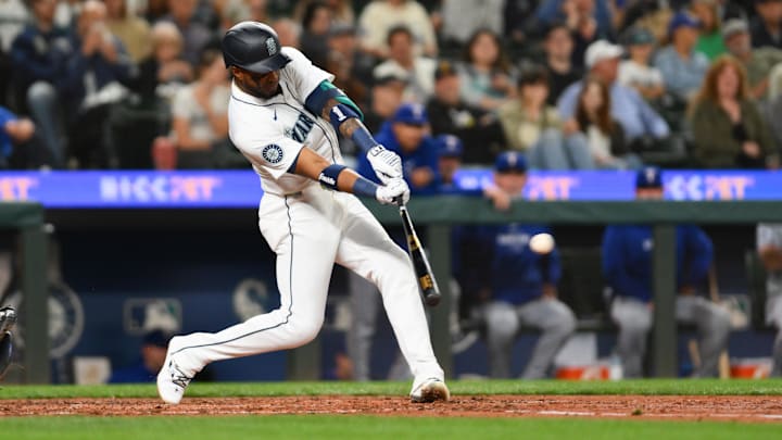 Seattle Mariners right fielder Victor Robles hits a single during a game against the Texas Rangers on Thursday at T-Mobile Park.