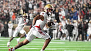 Sep 21, 2024; Chestnut Hill, Massachusetts, USA; Boston College Eagles wide receiver Lewis Bond (11) runs after the catch for a touchdown against the Michigan State Spartans during the second half at Alumni Stadium. Mandatory Credit: Eric Canha-Imagn Images