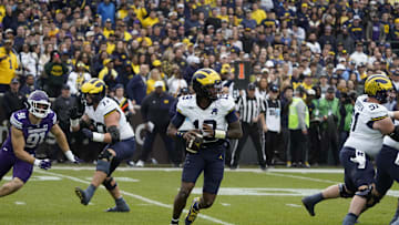 Nov 15, 2025; Chicago, Illinois, USA; Michigan Wolverines quarterback Bryce Underwood (19) throws the ball against the Northwestern Wildcats during the first half at Wrigley Field. Mandatory Credit: David Banks-Imagn Images
