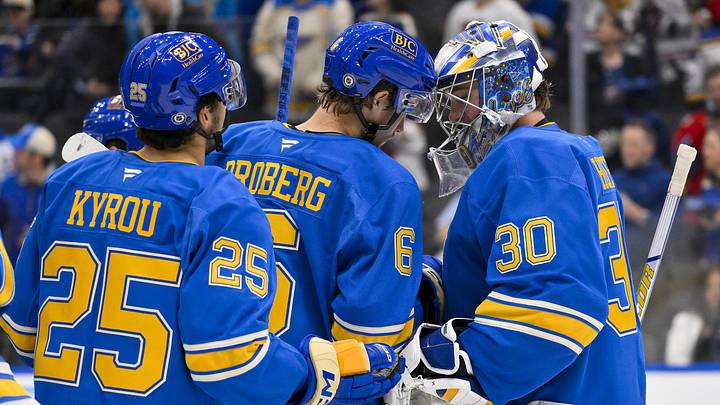 Mar 22, 2025; St. Louis, Missouri, USA;  St. Louis Blues goaltender Joel Hofer (30) and defenseman Philip Broberg (6) celebrate after the Blues defeated the Chicago Blackhawks at Enterprise Center. Mandatory Credit: Jeff Curry-Imagn Images