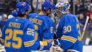 Mar 22, 2025; St. Louis, Missouri, USA;  St. Louis Blues goaltender Joel Hofer (30) and defenseman Philip Broberg (6) celebrate after the Blues defeated the Chicago Blackhawks at Enterprise Center. Mandatory Credit: Jeff Curry-Imagn Images