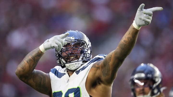 Dec 8, 2024; Glendale, Arizona, USA; Seattle Seahawks defensive end Leonard Williams (99) celebrates a tackle in the second half against the Arizona Cardinals at State Farm Stadium. Dec 8, 2024; Glendale, Arizona, USA; Seattle Seahawks defensive end Leonard Williams (99) celebrates a tackle in the second half against the Arizona Cardinals at State Farm Stadium.