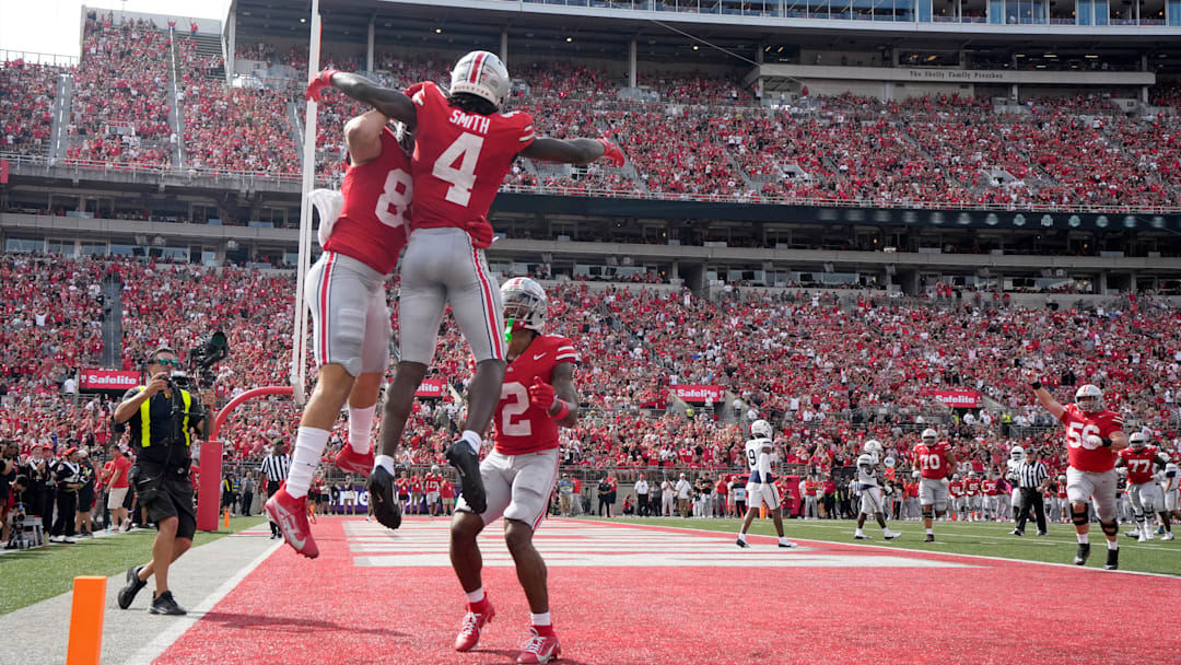 August 31, 2024; Columbus, Ohio, USA;
Ohio State Buckeyes wide receiver Jeremiah Smith (4) celebrates with teammates after scoring a touchdown during the first half of Saturday’s NCAA Division I football game against the Akron Zips at Ohio Stadium.