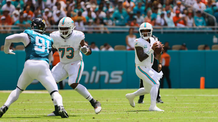 Sep 8, 2024; Miami Gardens, Florida, USA; Miami Dolphins quarterback Tua Tagovailoa (1) looks for a passing option against the Jacksonville Jaguars during the first quarter at Hard Rock Stadium. Mandatory Credit: Sam Navarro-Imagn Images