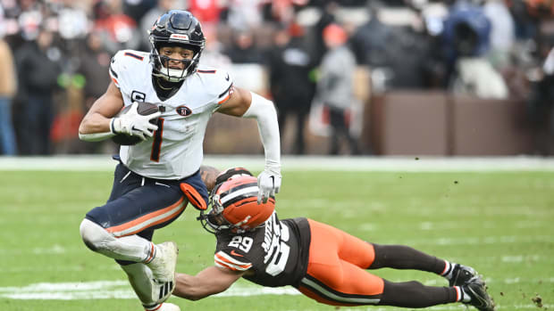 Cleveland Browns cornerback Cameron Mitchell (29) tackles Chicago Bears quarterback Justin Fields (1)