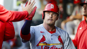 Sep 9, 2025; Seattle, Washington, USA; St. Louis Cardinals third baseman Nolan Gorman (16) high-fives teammates in the dugout after scoring a run against the Seattle Mariners during the second inning at T-Mobile Park. Mandatory Credit: Joe Nicholson-Imagn Images