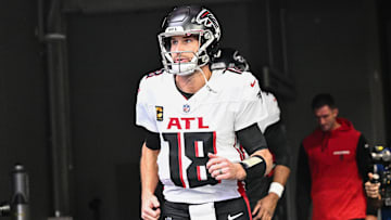 Dec 8, 2024; Minneapolis, Minnesota, USA; Atlanta Falcons quarterback Kirk Cousins (18) enters the field before the game against the Minnesota Vikings at U.S. Bank Stadium.