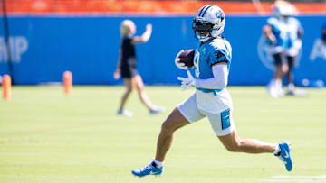 Carolina Panthers wide receiver Adam Thielen runs after a catch during practice at training camp.
