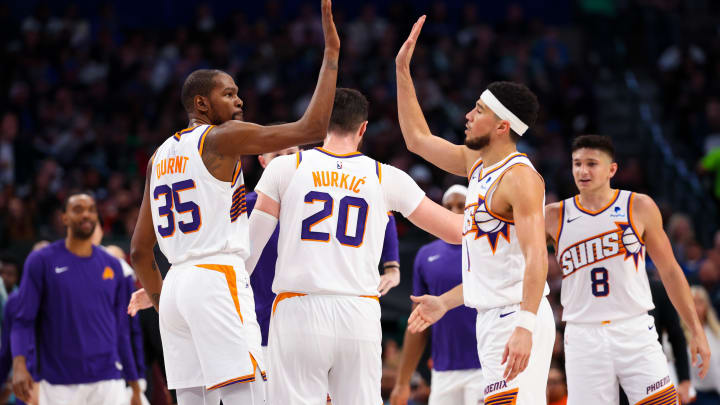 Jan 24, 2024; Dallas, Texas, USA;  Phoenix Suns guard Devin Booker (1) celebrates with Phoenix Suns