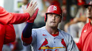 Sep 9, 2025; Seattle, Washington, USA; St. Louis Cardinals third baseman Nolan Gorman (16) high-fives teammates in the dugout after scoring a run against the Seattle Mariners during the second inning at T-Mobile Park. Mandatory Credit: Joe Nicholson-Imagn Images