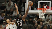 Oct 30, 2025; San Antonio, Texas, USA; Miami Heat forward Bam Adebayo (13) dunks ahead of San Antonio Spurs forward Victor Wembanyama (1) during the first at Frost Bank Center. Mandatory Credit: Scott Wachter-Imagn Images