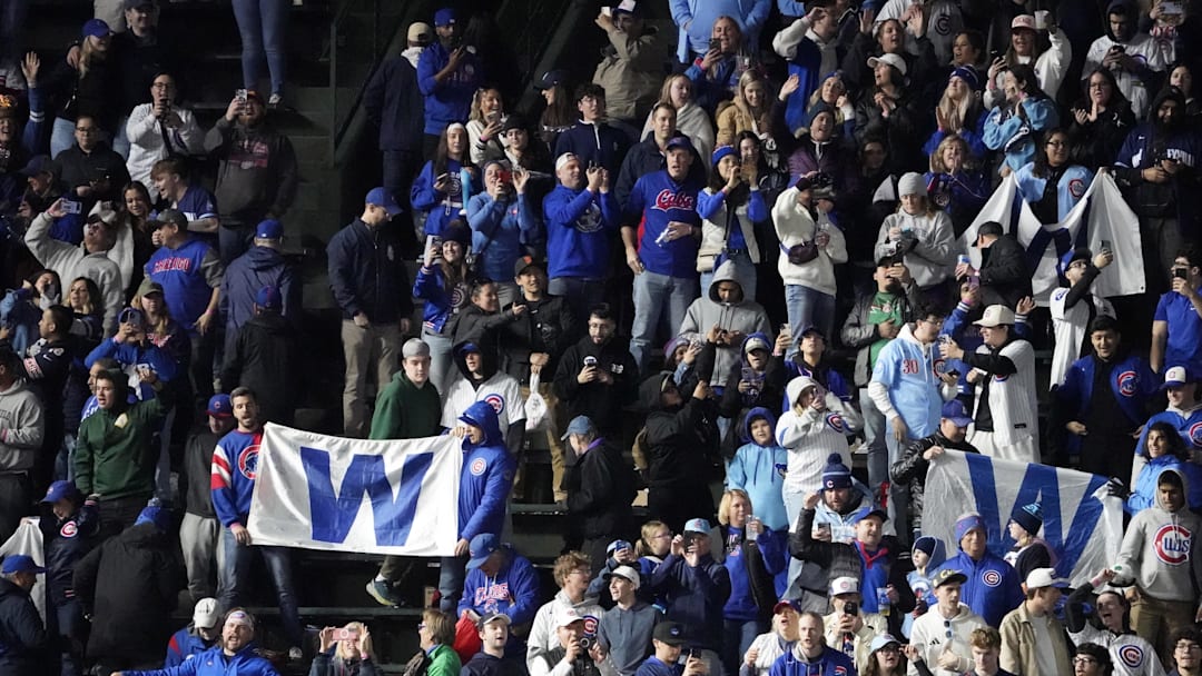 May 5, 2025; Chicago, Illinois, USA; Fans celebrate the Chicago Cubs win against the San Francisco Giants at Wrigley Field. David Banks-Imagn Images