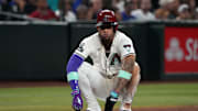 Sep 24, 2025; Phoenix, Arizona, USA; Arizona Diamondbacks second base Ketel Marte (4) sits on the base against the Los Angeles Dodgers in the first inning at Chase Field. Mandatory Credit: Rick Scuteri-Imagn Images