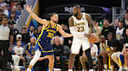 Jan 27, 2024; San Francisco, California, USA; Los Angeles Lakers forward LeBron James (23) handles the ball against Golden State Warriors guard Stephen Curry (30) during overtime at Chase Center. Mandatory Credit: Darren Yamashita-Imagn Images